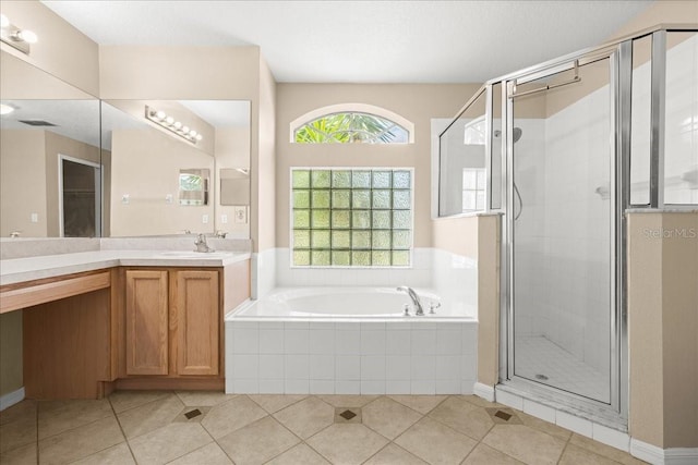 10 Zebrawood Ct, Palm Coast, FL 32164 - full bathroom featuring vanity, a shower stall, tile patterned floors, and a bath