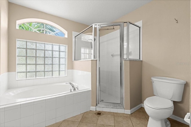 10 Zebrawood Ct, Palm Coast, FL 32164 - bathroom with toilet, a shower stall, a healthy amount of sunlight, and a bath