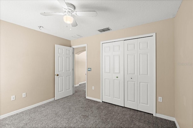 10 Zebrawood Ct, Palm Coast, FL 32164 - unfurnished bedroom featuring visible vents, a closet, baseboards, a textured ceiling, and carpet flooring