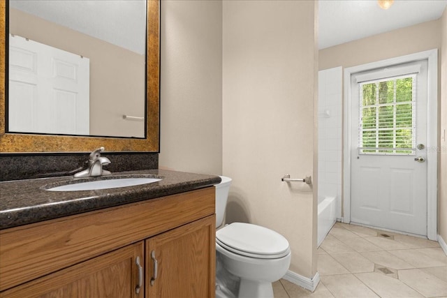 10 Zebrawood Ct, Palm Coast, FL 32164 - bathroom featuring tile patterned floors, baseboards, vanity, and toilet