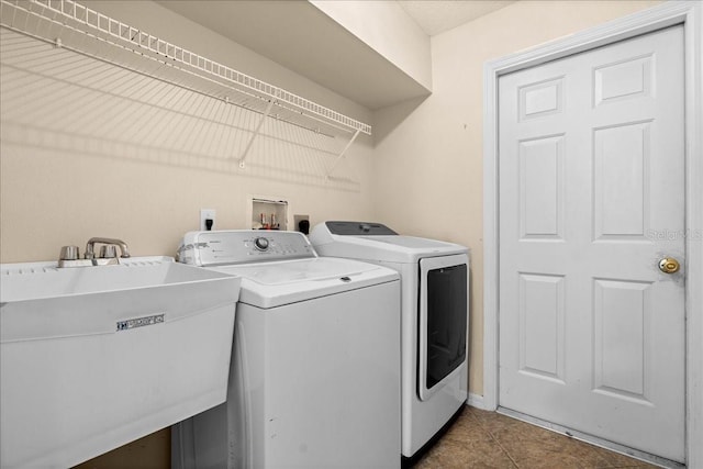 10 Zebrawood Ct, Palm Coast, FL 32164 - washroom with laundry area, a sink, tile patterned flooring, and washing machine and clothes dryer