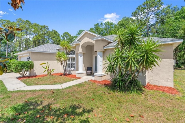 10 Zebrawood Ct, Palm Coast, FL 32164 - view of front of property featuring a garage, stucco siding, and a front lawn