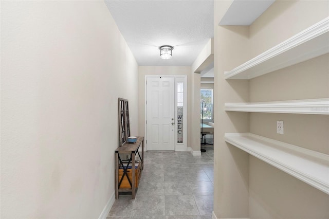 2337 Oxmoor Dr, Deland, FL 32724 - foyer entrance featuring baseboards and light tile patterned flooring