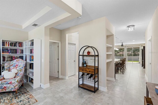 2337 Oxmoor Dr, Deland, FL 32724 - sitting room with a textured ceiling, baseboards, light tile patterned floors, and a ceiling fan