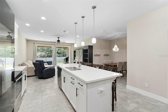 2337 Oxmoor Dr, Deland, FL 32724 - kitchen featuring a ceiling fan, a sink, dishwasher, recessed lighting, and a breakfast bar area