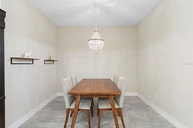 2337 Oxmoor Dr, Deland, FL 32724 - dining area with a chandelier and baseboards