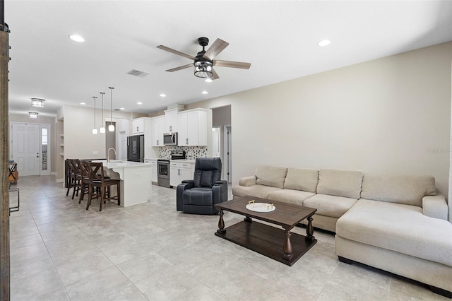 2337 Oxmoor Dr, Deland, FL 32724 - living area featuring a ceiling fan, recessed lighting, and light tile patterned floors