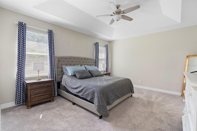 2337 Oxmoor Dr, Deland, FL 32724 - bedroom featuring a raised ceiling, multiple windows, and light carpet