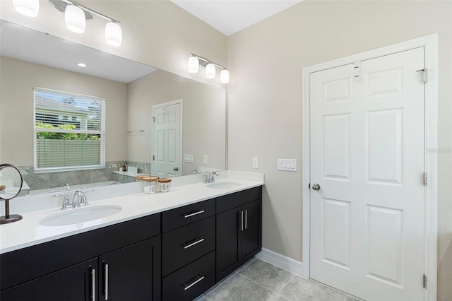 2337 Oxmoor Dr, Deland, FL 32724 - full bath featuring double vanity, tile patterned flooring, and baseboards