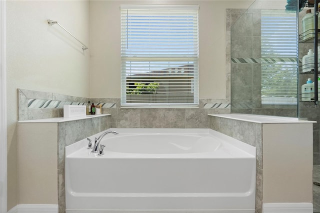 2337 Oxmoor Dr, Deland, FL 32724 - full bathroom featuring a garden tub and baseboards