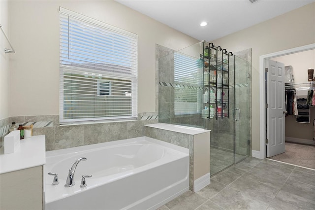 2337 Oxmoor Dr, Deland, FL 32724 - full bathroom featuring a garden tub, a shower stall, and healthy amount of natural light