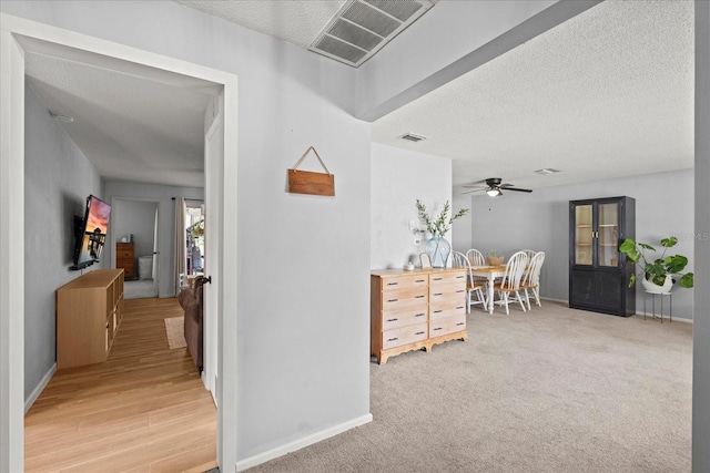 736 Lindenwood Cir W, Ormond Beach, FL 32174 - hall featuring a textured ceiling and baseboards