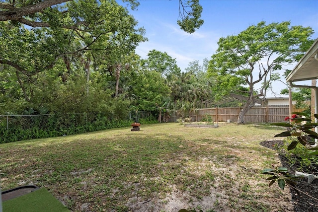736 Lindenwood Cir W, Ormond Beach, FL 32174 - view of yard with an outdoor fire pit