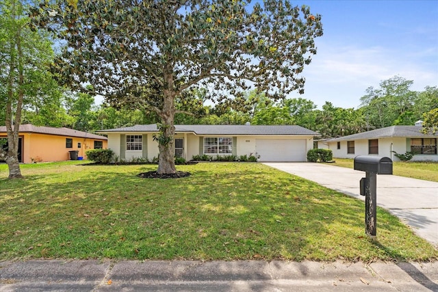 736 Lindenwood Cir W, Ormond Beach, FL 32174 - ranch-style home with driveway, an attached garage, and a front yard
