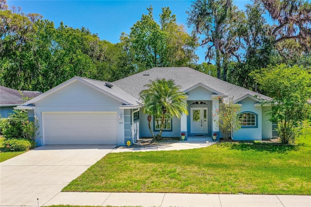105 Riviera Estates Blvd, Ormond Beach, FL 32174 - ranch-style house featuring concrete driveway, an attached garage, stucco siding, and a front yard