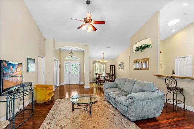 105 Riviera Estates Blvd, Ormond Beach, FL 32174 - living room with dark wood-type flooring, arched walkways, baseboards, and ceiling fan with notable chandelier