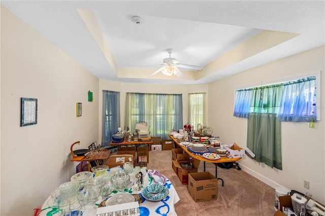 105 Riviera Estates Blvd, Ormond Beach, FL 32174 - interior space with baseboards, carpet flooring, a raised ceiling, and ceiling fan