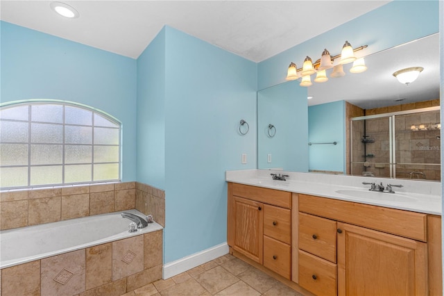 105 Riviera Estates Blvd, Ormond Beach, FL 32174 - full bathroom with a shower stall, tile patterned flooring, double vanity, a sink, and a garden tub