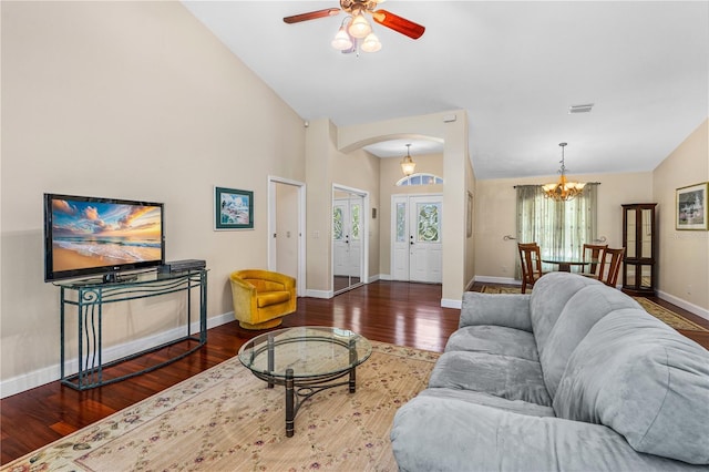 105 Riviera Estates Blvd, Ormond Beach, FL 32174 - living area featuring arched walkways, wood finished floors, baseboards, and ceiling fan with notable chandelier