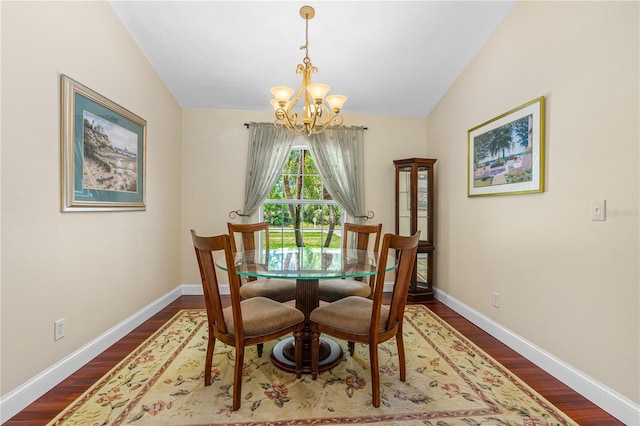 105 Riviera Estates Blvd, Ormond Beach, FL 32174 - dining room featuring dark wood finished floors, lofted ceiling, baseboards, and a notable chandelier