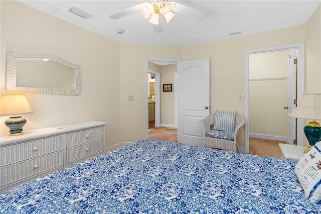 105 Riviera Estates Blvd, Ormond Beach, FL 32174 - bedroom featuring a spacious closet, carpet floors, visible vents, and ceiling fan