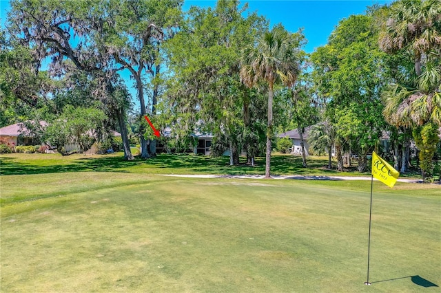 105 Riviera Estates Blvd, Ormond Beach, FL 32174 - view of home's community with golf course view and a yard