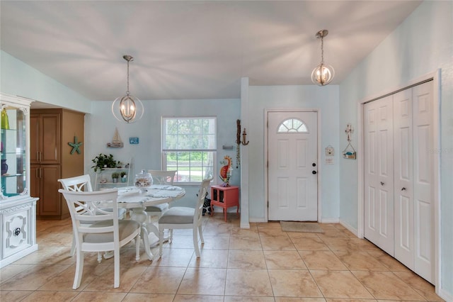 952 Northbrook Dr, Ormond Beach, FL 32174 - foyer entrance featuring a notable chandelier and light tile patterned flooring