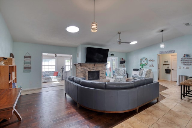952 Northbrook Dr, Ormond Beach, FL 32174 - living room featuring baseboards, lofted ceiling, a brick fireplace, ceiling fan, and hardwood / wood-style floors