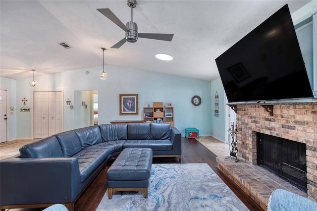 952 Northbrook Dr, Ormond Beach, FL 32174 - living room with vaulted ceiling, visible vents, a ceiling fan, wood finished floors, and a brick fireplace