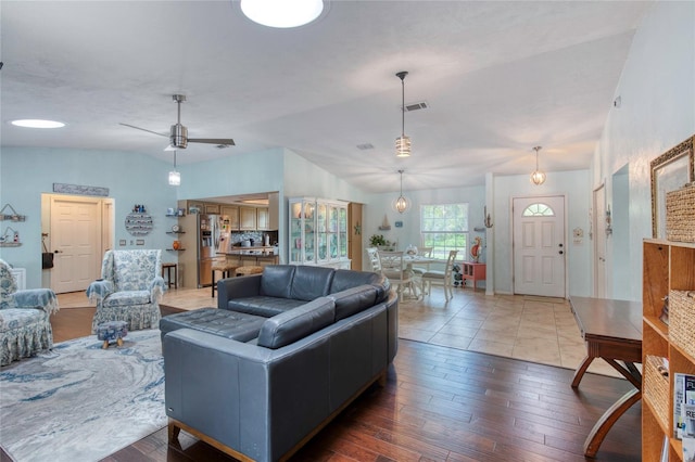952 Northbrook Dr, Ormond Beach, FL 32174 - living room with hardwood / wood-style flooring, vaulted ceiling, a ceiling fan, and visible vents