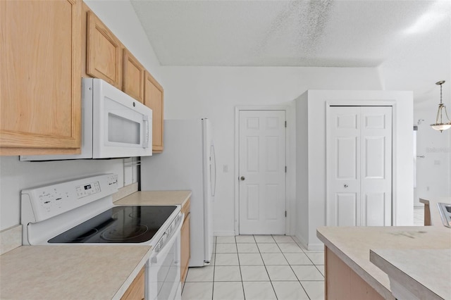 3214 Juniper Dr, Edgewater, FL 32141 - kitchen featuring light tile patterned floors, white appliances, and light countertops
