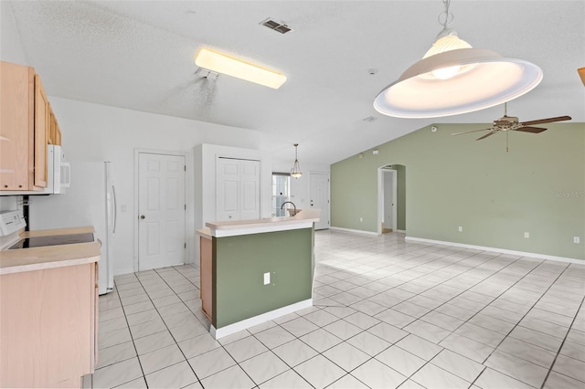 3214 Juniper Dr, Edgewater, FL 32141 - kitchen with light tile patterned floors, white microwave, ceiling fan, and electric range