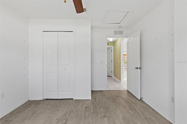 3214 Juniper Dr, Edgewater, FL 32141 - unfurnished bedroom with light wood finished floors, baseboards, and a closet