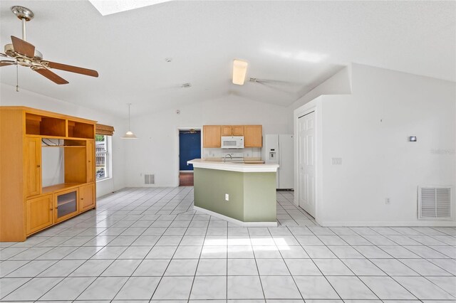 3214 Juniper Dr, Edgewater, FL 32141 - kitchen with visible vents, white appliances, lofted ceiling with skylight, and ceiling fan
