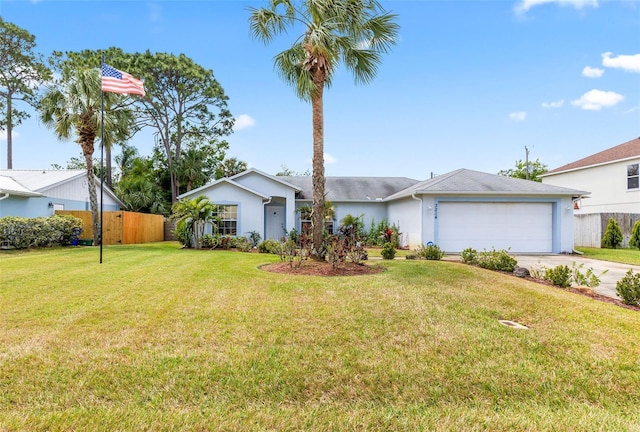 3214 Juniper Dr, Edgewater, FL 32141 - ranch-style home featuring fence, a front lawn, stucco siding, an attached garage, and concrete driveway