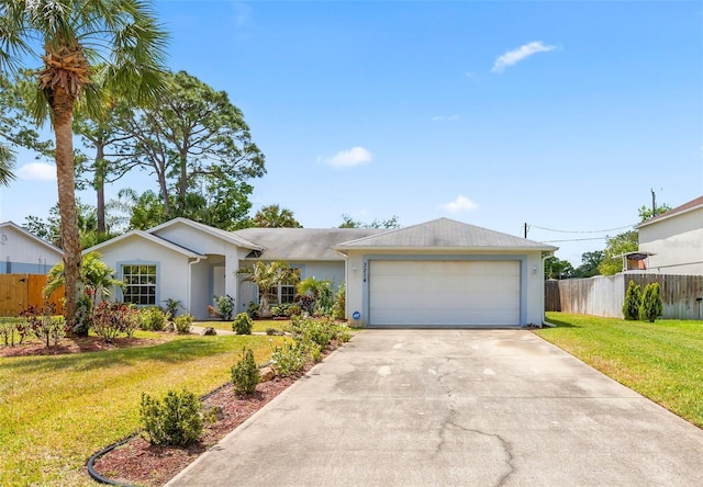 3214 Juniper Dr, Edgewater, FL 32141 - single story home with fence, stucco siding, an attached garage, concrete driveway, and a front yard