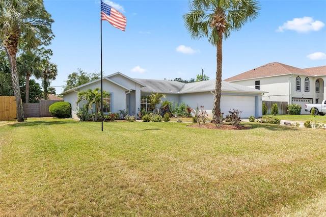 3214 Juniper Dr, Edgewater, FL 32141 - view of front of home with a garage, stucco siding, a front yard, and fence