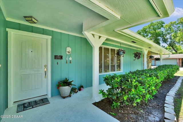 entrance to property featuring board and batten siding