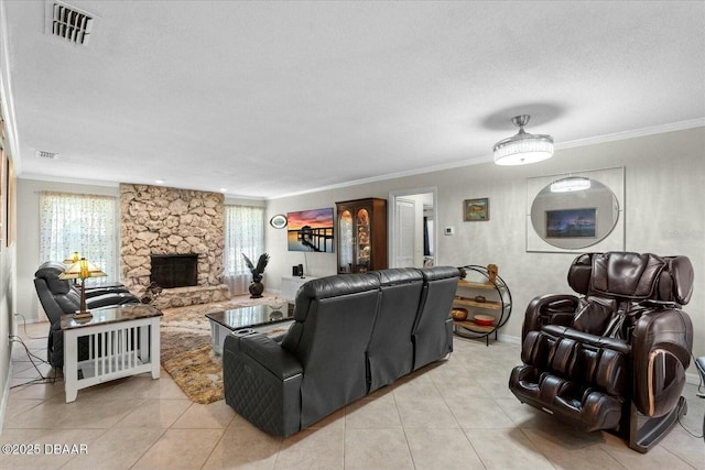 living area with a stone fireplace, visible vents, ornamental molding, light tile patterned flooring, and a textured ceiling