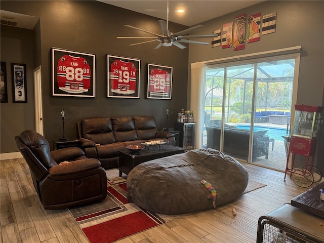 4749 Stoneview Cir, Oldsmar, FL 34677 - living area featuring a ceiling fan, wood finished floors, and recessed lighting