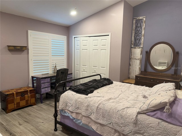 4749 Stoneview Cir, Oldsmar, FL 34677 - bedroom with wood finished floors, lofted ceiling, and a closet