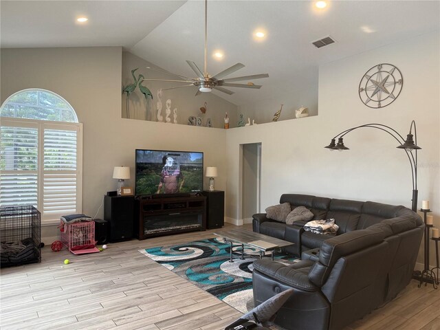 4749 Stoneview Cir, Oldsmar, FL 34677 - living room with ceiling fan, high vaulted ceiling, wood finished floors, recessed lighting, and baseboards