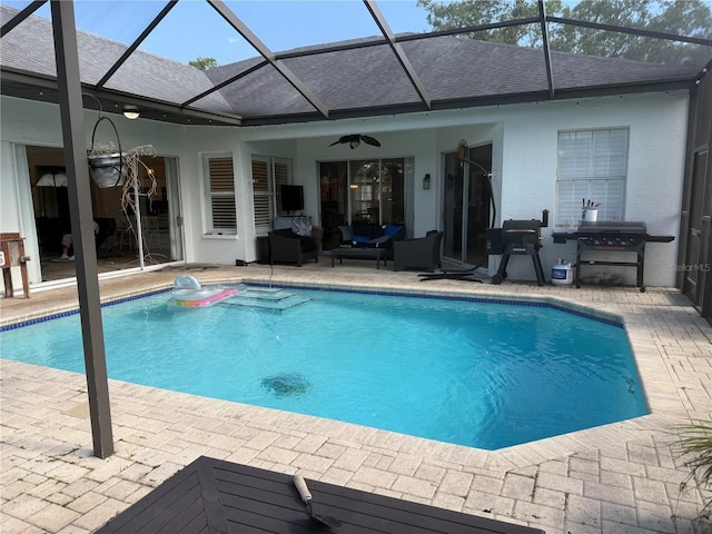 4749 Stoneview Cir, Oldsmar, FL 34677 - outdoor pool with a patio, a ceiling fan, outdoor lounge area, and glass enclosure