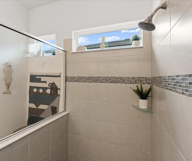 full bath featuring a tile shower