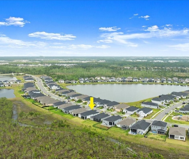 birds eye view of property with a water view and a residential view