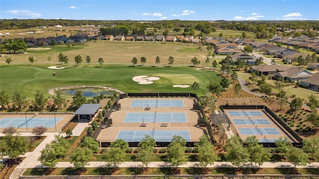 birds eye view of property featuring view of golf course and a residential view
