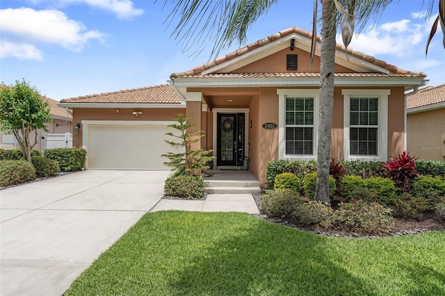 3451 Luna Bella Ln, New Smyrna Beach, FL 32168 - view of front of house featuring concrete driveway, an attached garage, a front lawn, and stucco siding