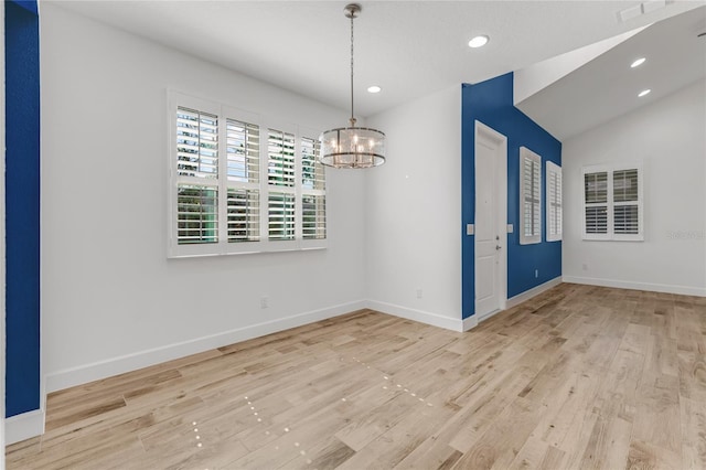 484 Landshark Blvd, Daytona Beach, FL 32124 - unfurnished dining area featuring an inviting chandelier, baseboards, recessed lighting, and light wood-style flooring