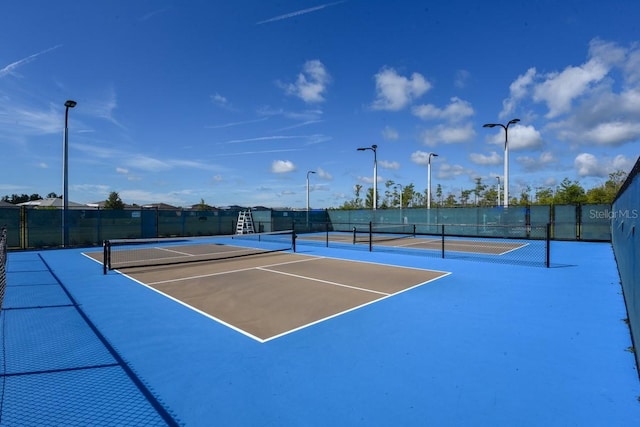 484 Landshark Blvd, Daytona Beach, FL 32124 - view of tennis court featuring fence and community basketball court