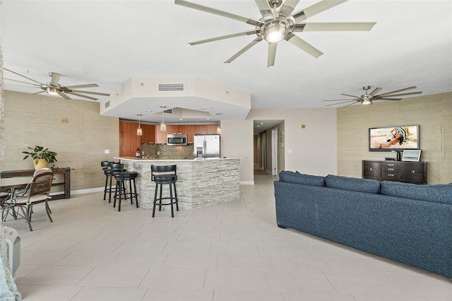 241 Riverside Dr Unit 902, Holly Hill, FL 32117 - living area with ceiling fan, baseboards, and visible vents